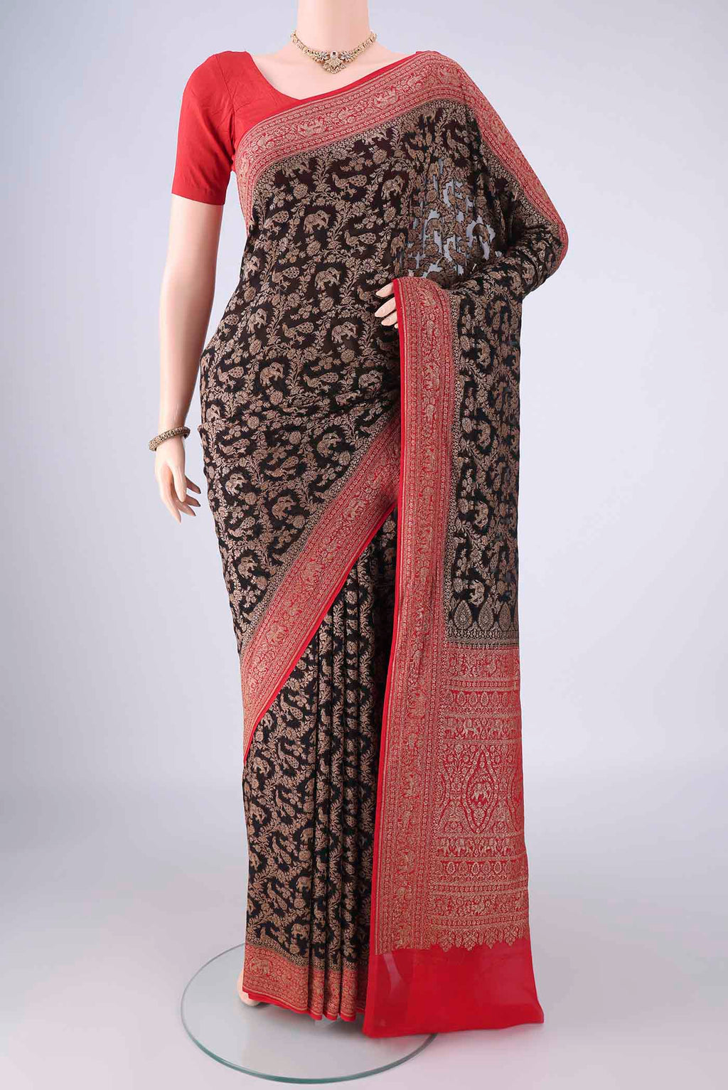 Black Banarasi Georgette Saree with Zari Brocade on the body and Zari Border.  displayed on a mannequin