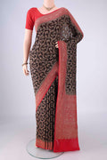 Black Banarasi Georgette Saree with Zari Brocade on the body and Zari Border.  displayed on a mannequin