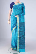 Blue Printed Silk Saree with Printed design on the body and Zari Border.  displayed on a mannequin