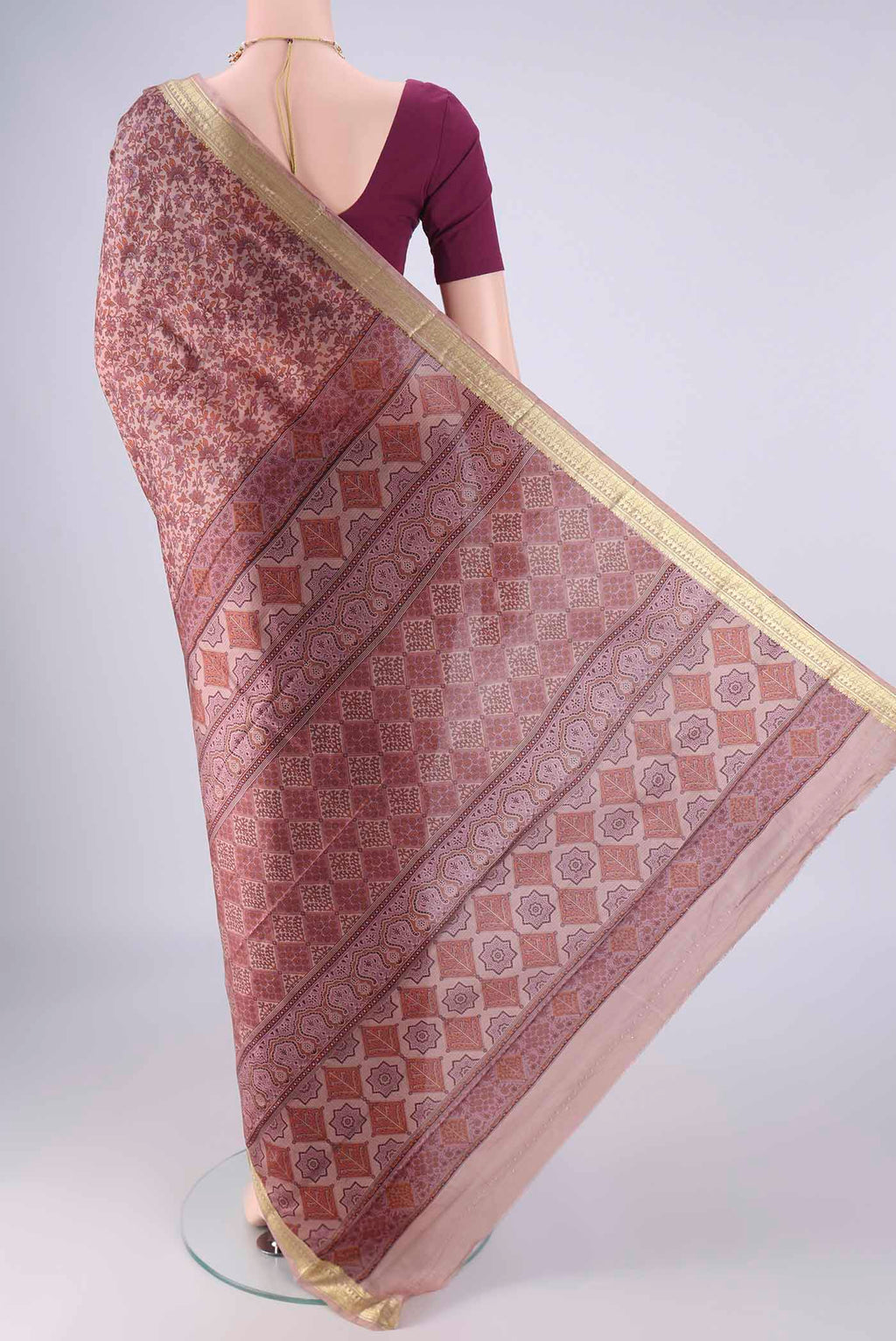 Flat view of Mauve Printed Silk Saree with Printed design on the body and Zari Border. 