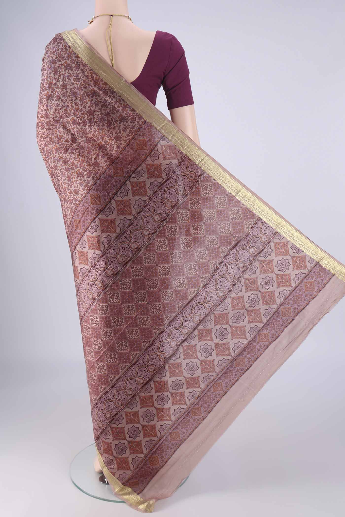 Flat view of Mauve Printed Silk Saree with Printed design on the body and Zari Border. 