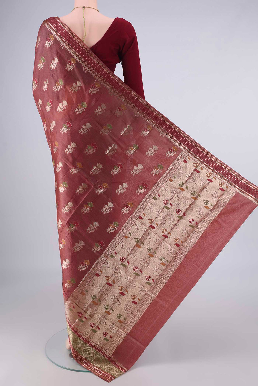 Flat view of Brown Banarasi Tussar Saree with Zari And Thread Butta on the body and Zari Border. 
