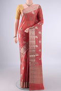 Rust Banarasi Tussar Saree with Zari And Thread Butta on the body and Zari And Thread Border.  displayed on a mannequin