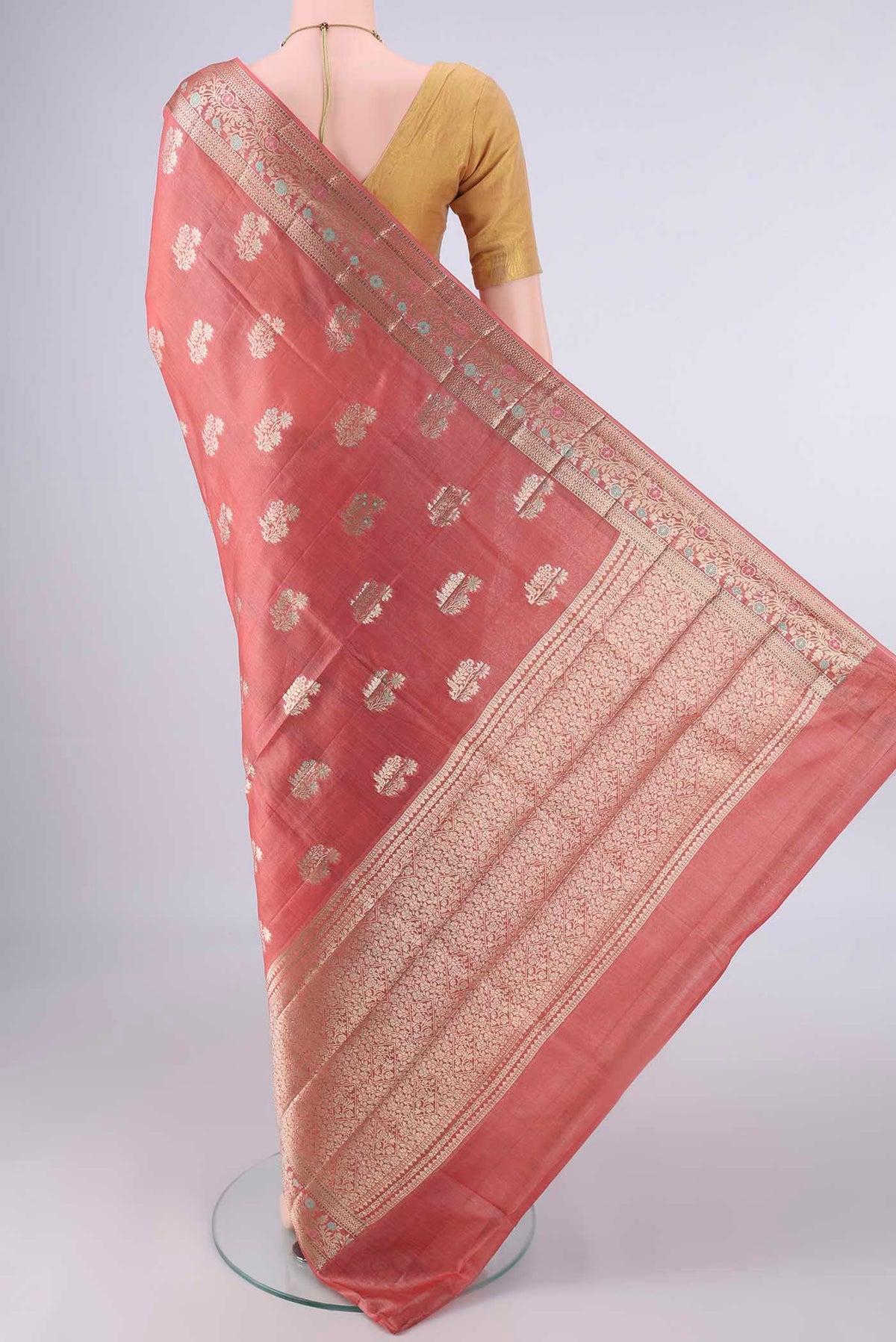 Flat view of Rust Banarasi Tussar Saree with Zari And Thread Butta on the body and Zari And Thread Border. 