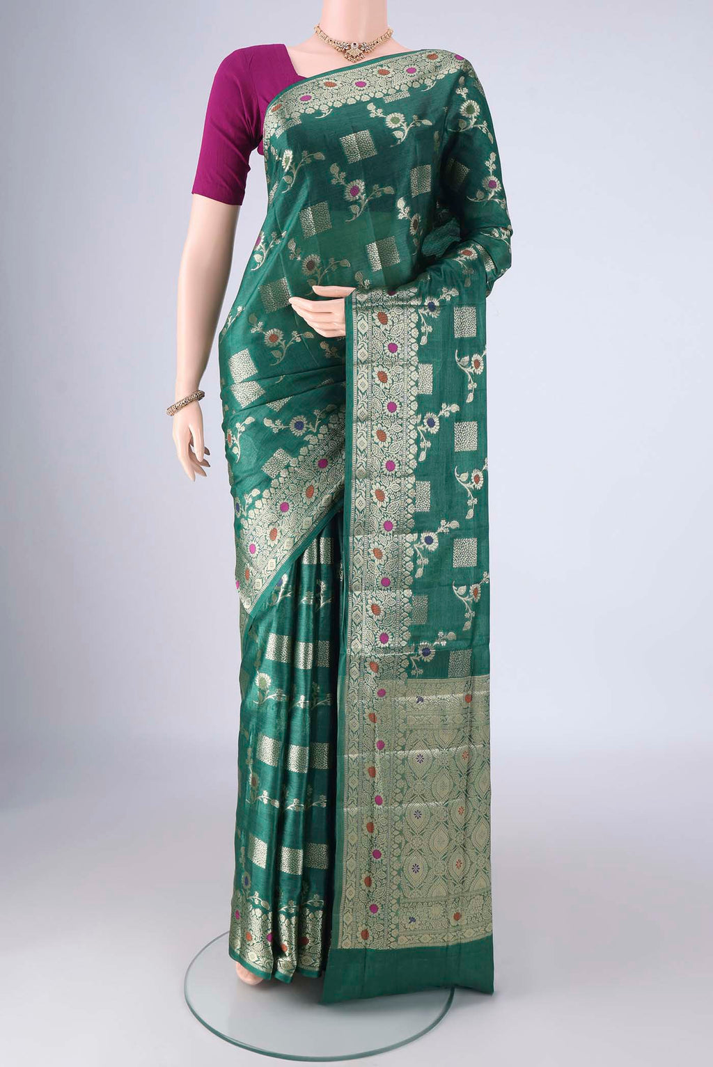 Green Banarasi Tussar Silk Saree with Zari Brocade on the body and Zari Border.  displayed on a mannequin