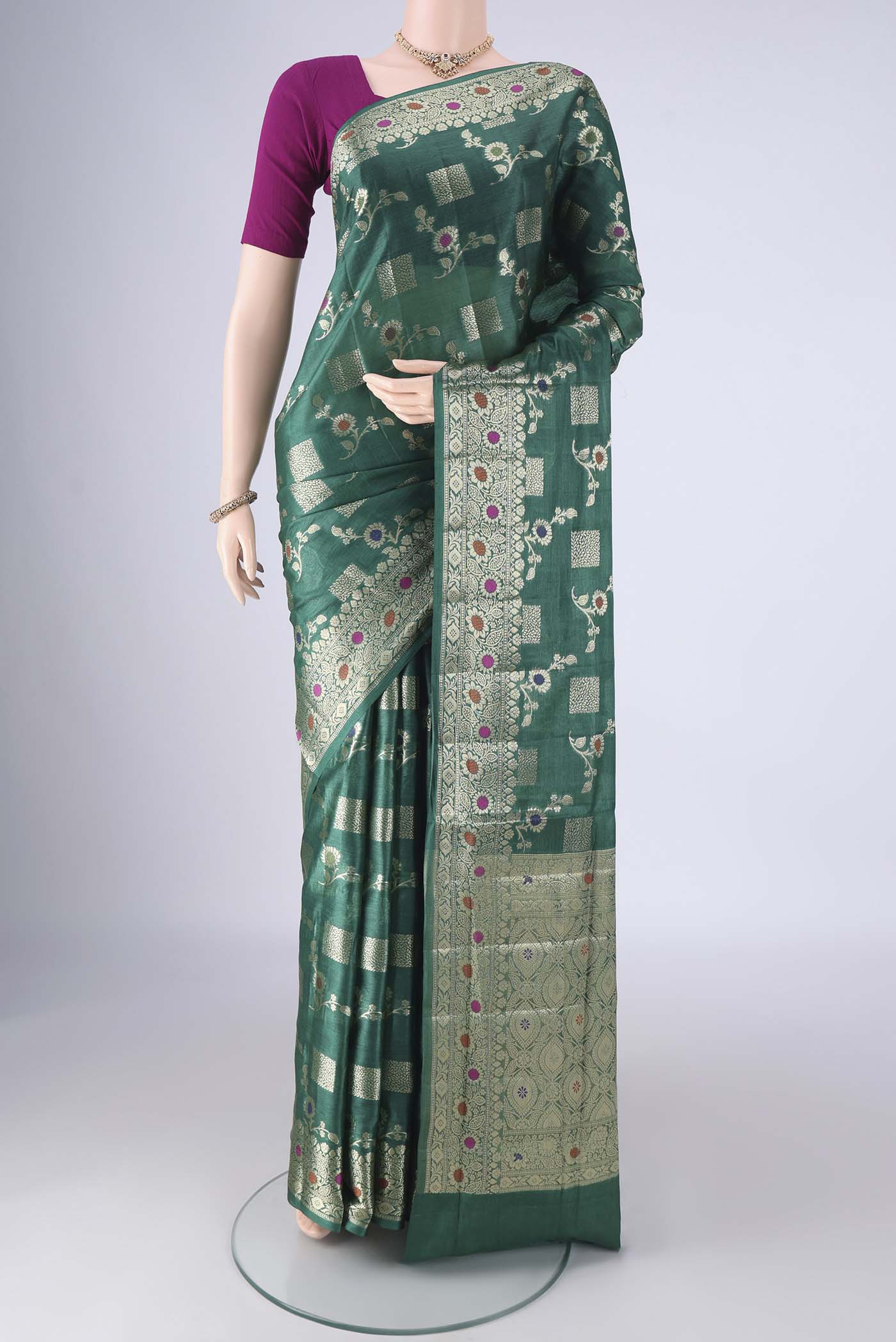 Green Banarasi Tussar Silk Saree with Zari Brocade on the body and Zari Border.  displayed on a mannequin