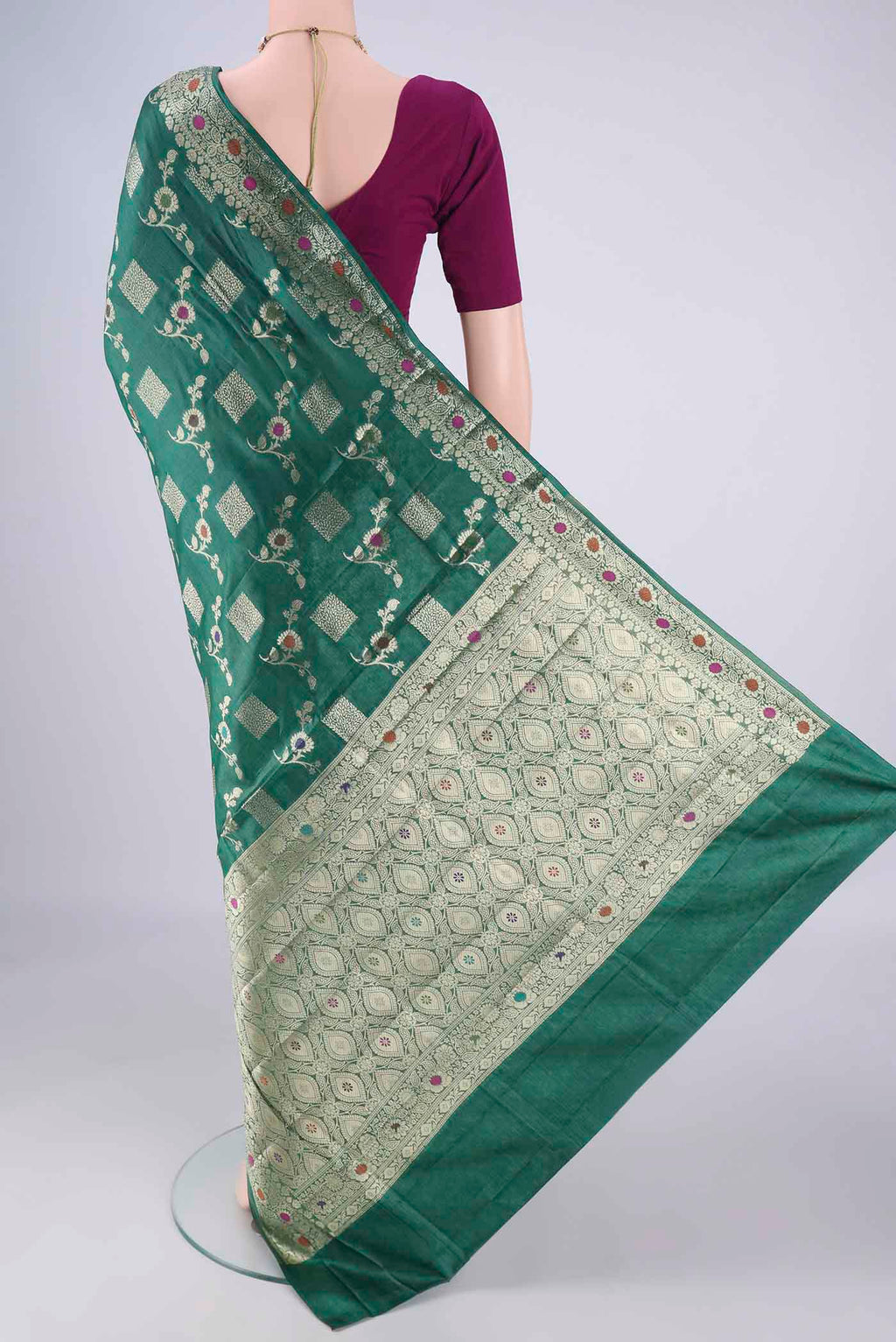 Flat view of Green Banarasi Tussar Silk Saree with Zari Brocade on the body and Zari Border. 