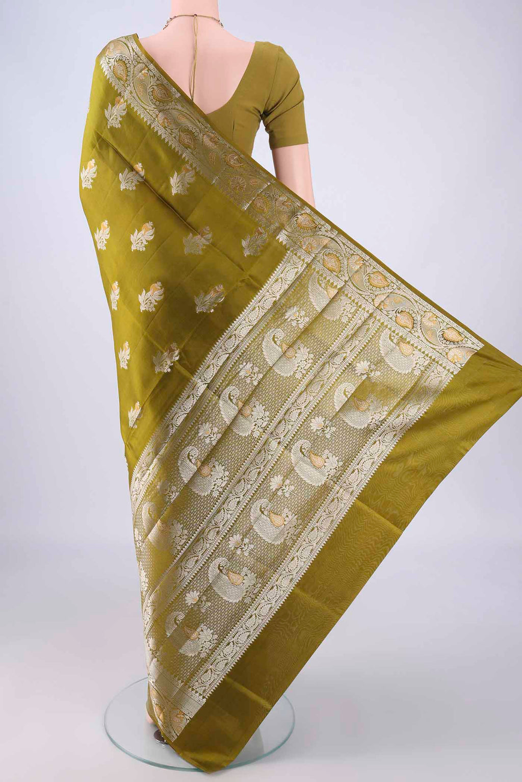 Flat view of Mehandi Green Banarasi Raw Silk Saree with Zari Butta on the body and Zari Border. 