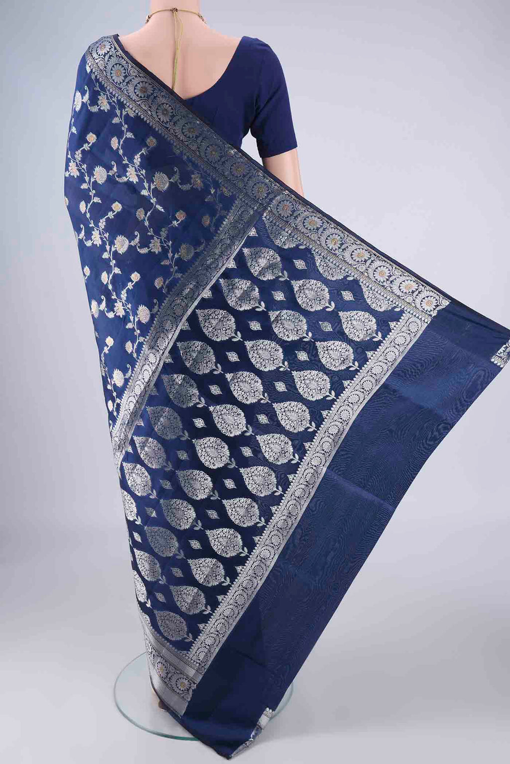 Flat view of Dark Blue Banarasi Raw Silk Saree with Zari Brocade on the body and Zari Border. 