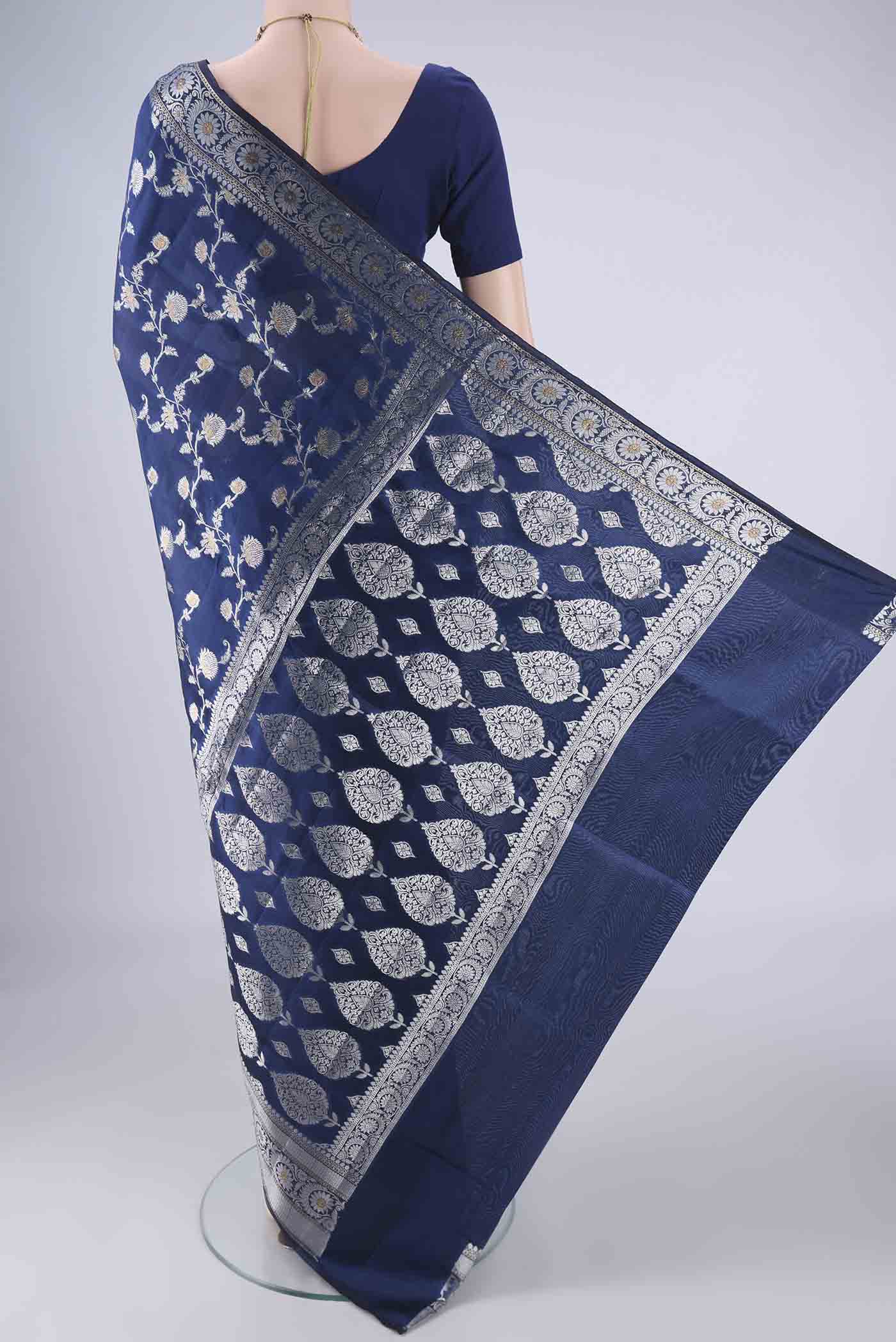 Flat view of Dark Blue Banarasi Raw Silk Saree with Zari Brocade on the body and Zari Border. 