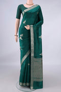 Pure Silk Sea Green Banarasi Raw Saree with Zari Butta on the body and Zari Border.  displayed on a mannequin