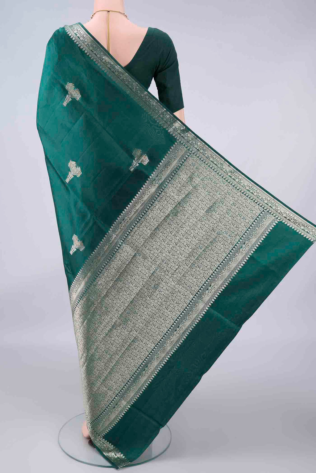 Flat view of Pure Silk Sea Green Banarasi Raw Saree with Zari Butta on the body and Zari Border. 