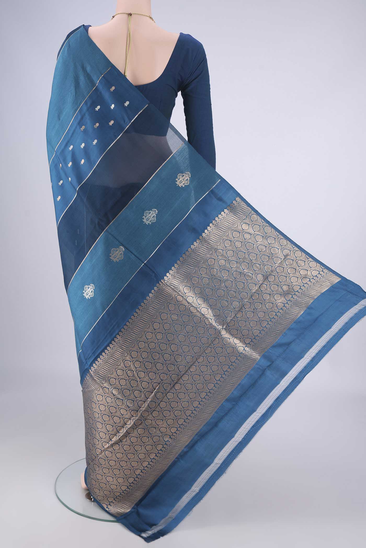 Flat view of Blue Banarasi Katan Silk Saree with Stripes on the body and Without Border. 