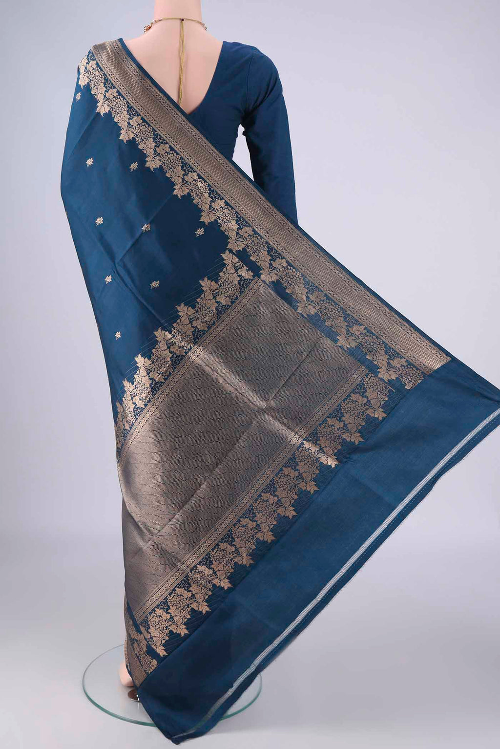 Flat view of Blue Banarasi Katan Silk Saree with Zari Butta on the body and Zari Border. 