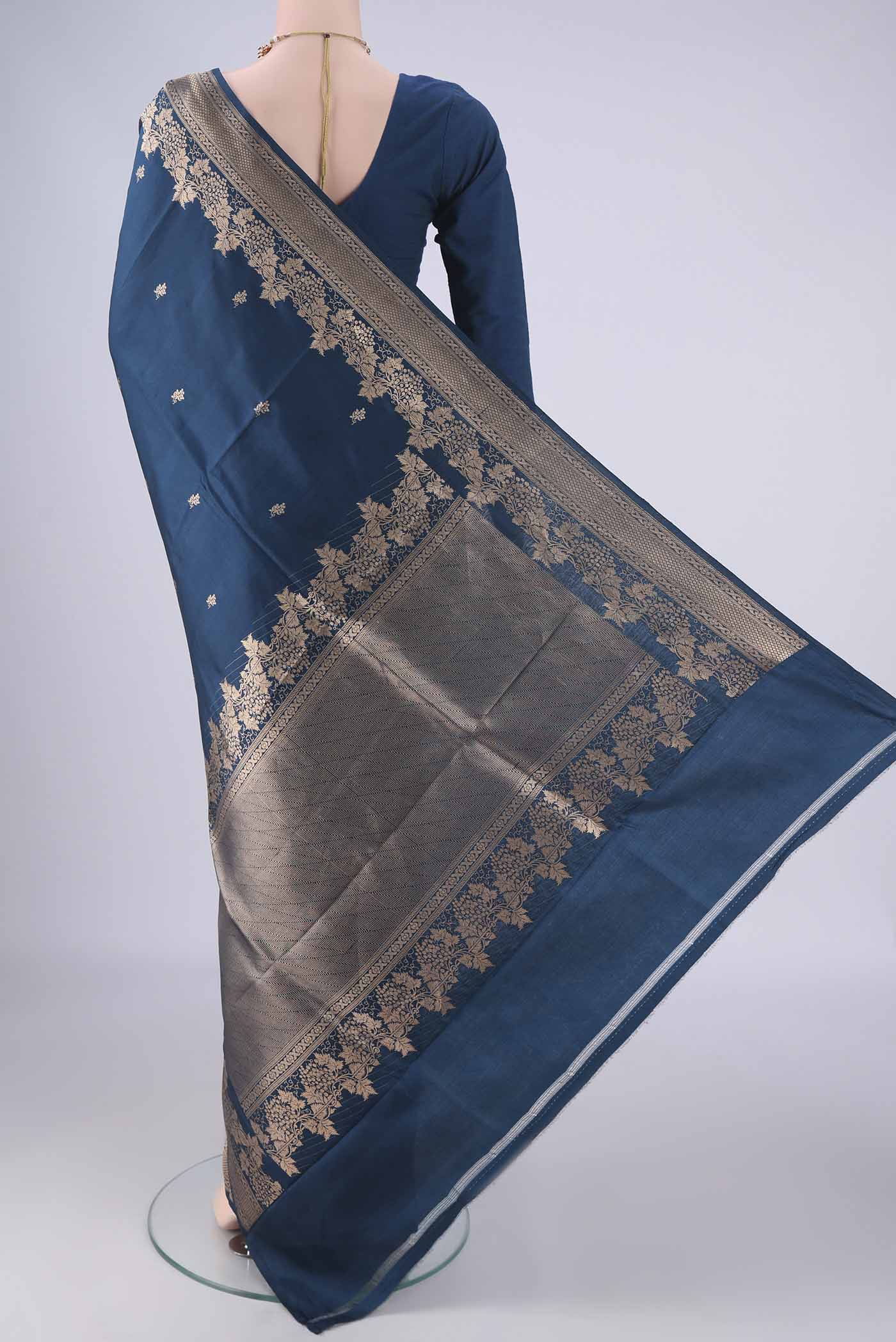 Flat view of Blue Banarasi Katan Silk Saree with Zari Butta on the body and Zari Border. 