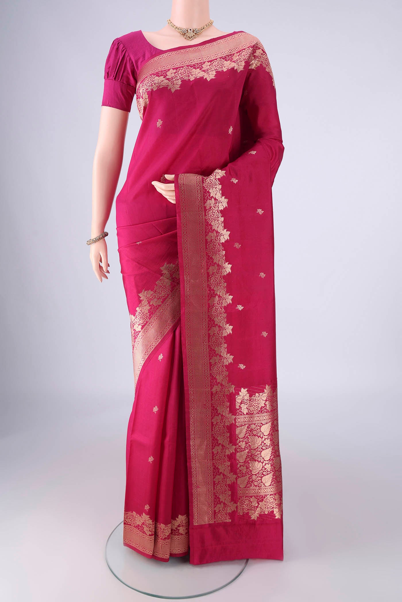 Pink Banarasi Katan Silk Saree with Zari Butta on the body and Zari Border.  displayed on a mannequin
