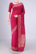 Dark Pink Banarasi Silk Saree with Zari Butta on the body and Zari Border.  displayed on a mannequin