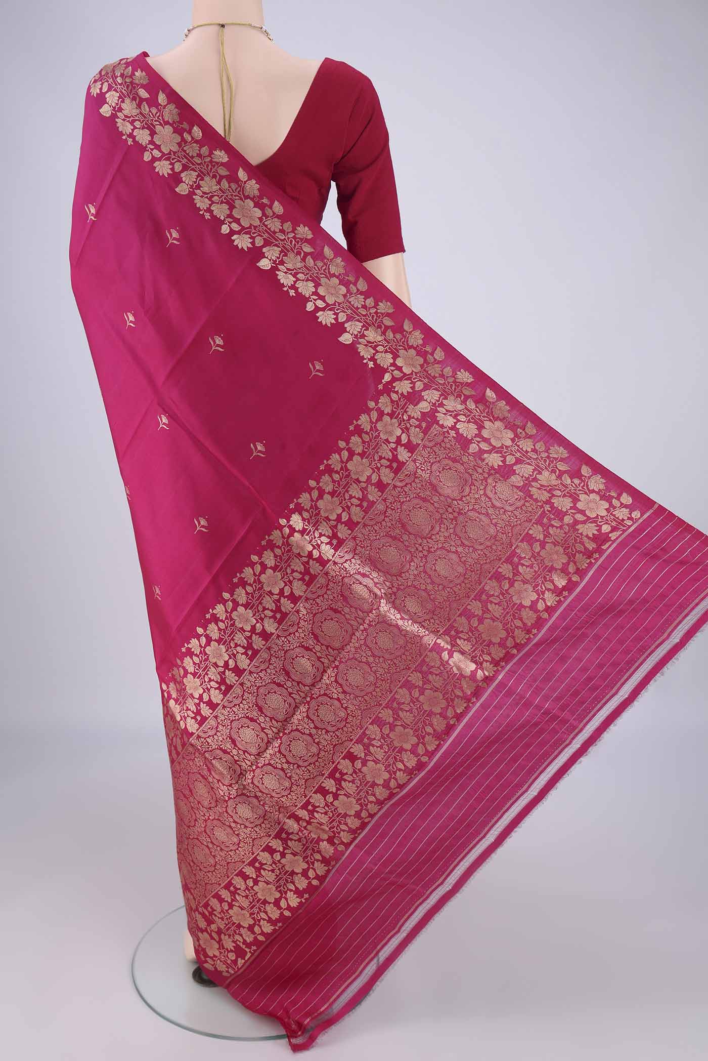 Flat view of Dark Pink Banarasi Silk Saree with Zari Butta on the body and Zari Border. 