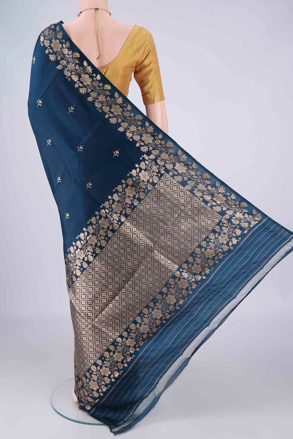 Flat view of Navy Blue Banarasi Katan Silk Saree with Zari Butta on the body and Zari Border. 
