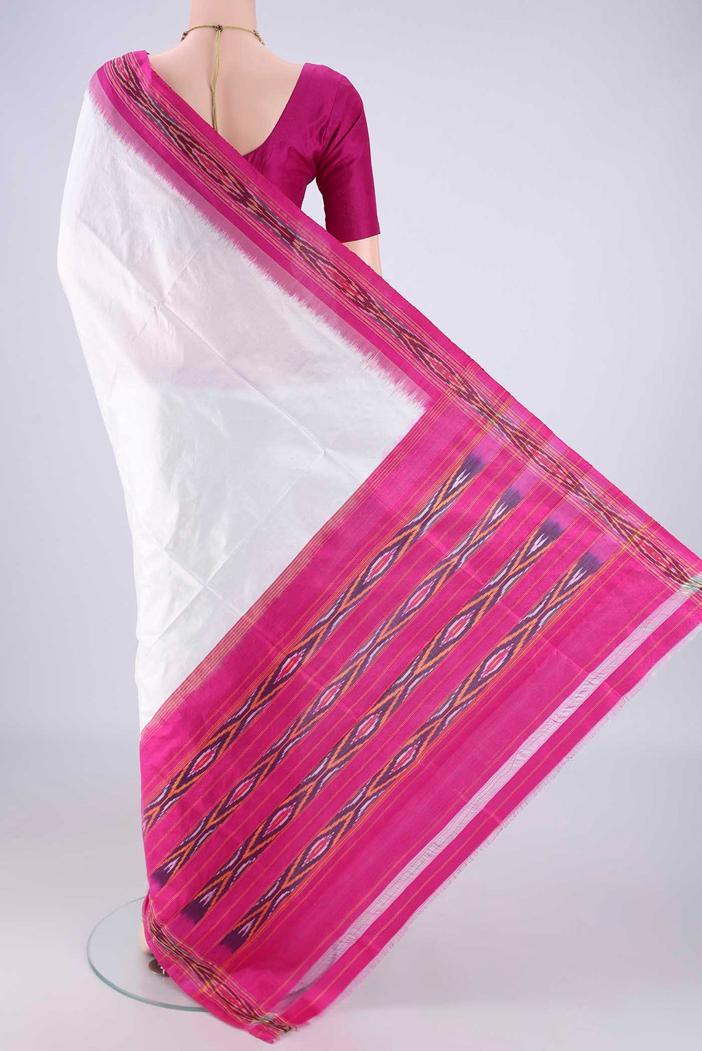 Flat view of White Pochampally Silk Saree with Plain Body and Ikat Border. 