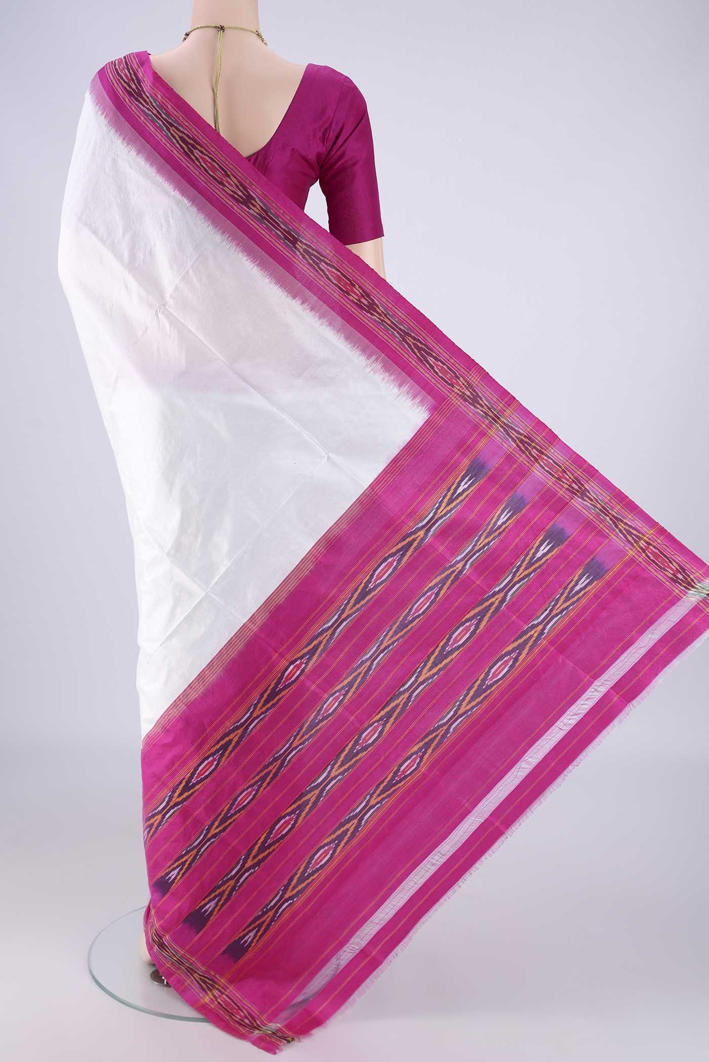 Flat view of White Pochampally Silk Saree with Plain Body and Ikat Border. 
