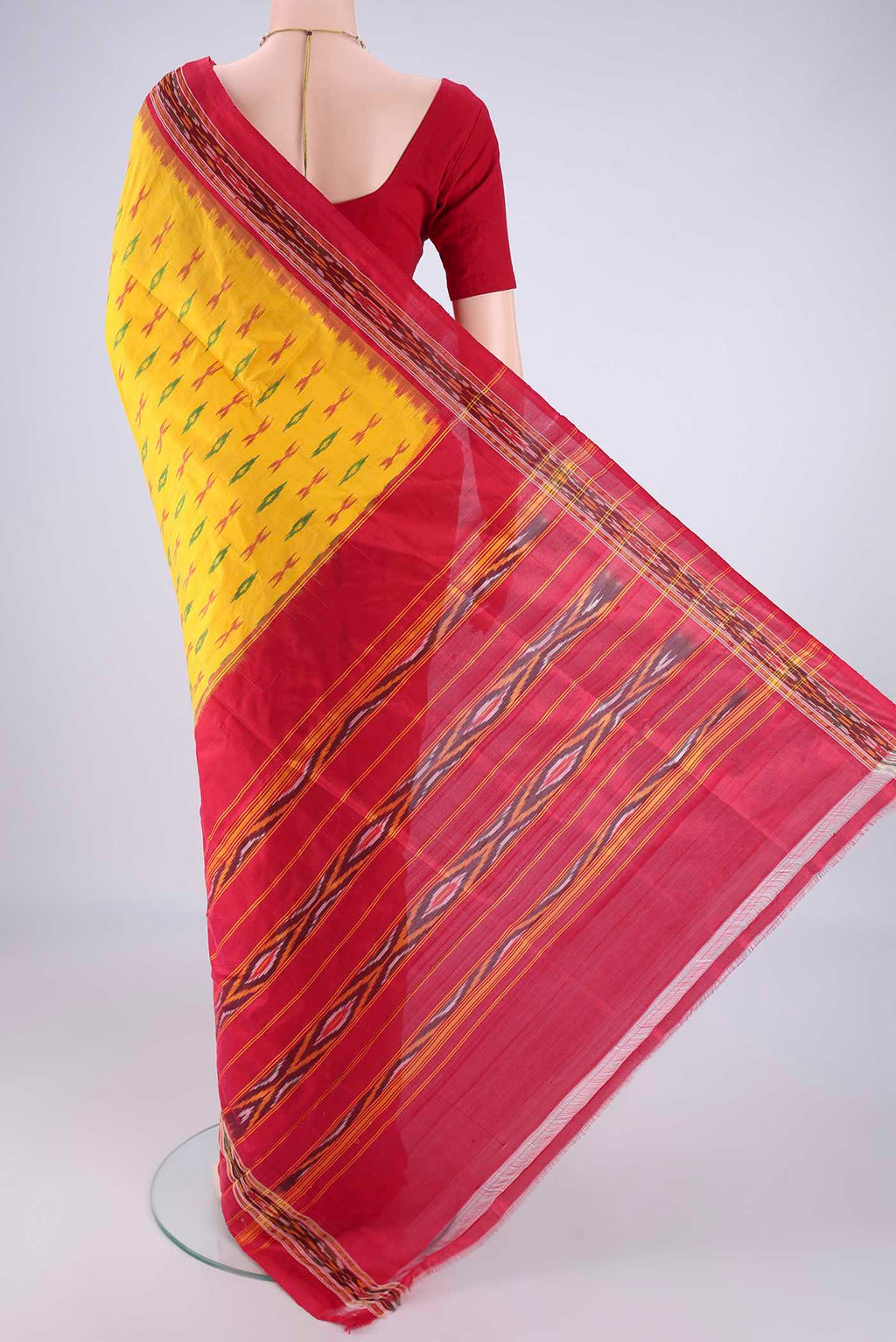Flat view of Yellow Pochampally Silk Saree with Pure Ikat on the body and Ikat Border. 
