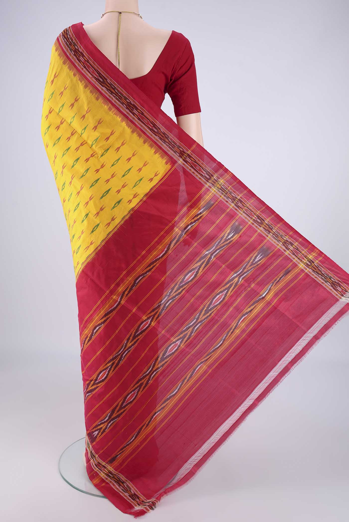 Flat view of Yellow Pochampally Silk Saree with Pure Ikat on the body and Ikat Border. 
