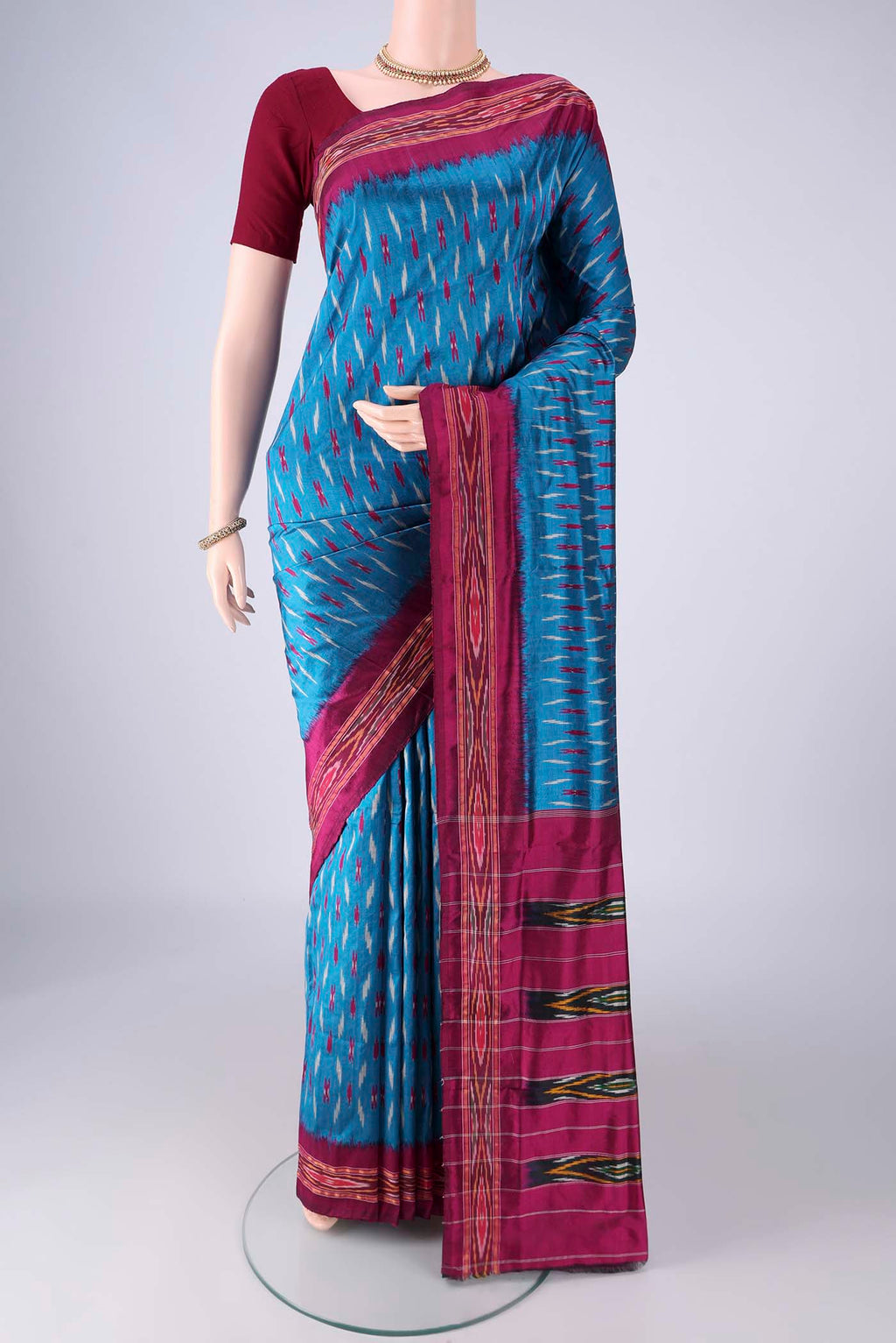 Blue Pochampally Silk Saree with Pure Ikat on the body and Ikat Border.  displayed on a mannequin