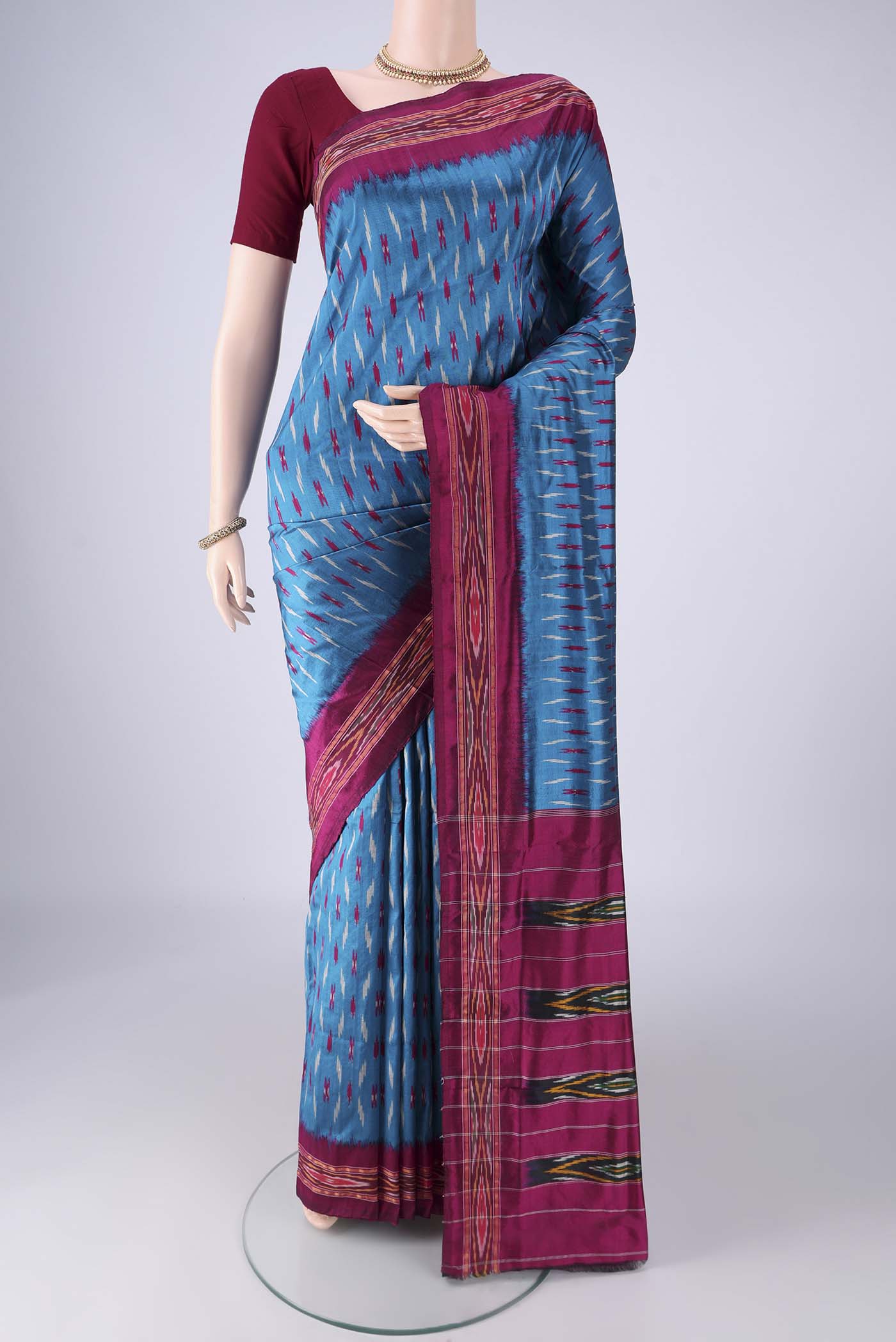 Blue Pochampally Silk Saree with Pure Ikat on the body and Ikat Border.  displayed on a mannequin