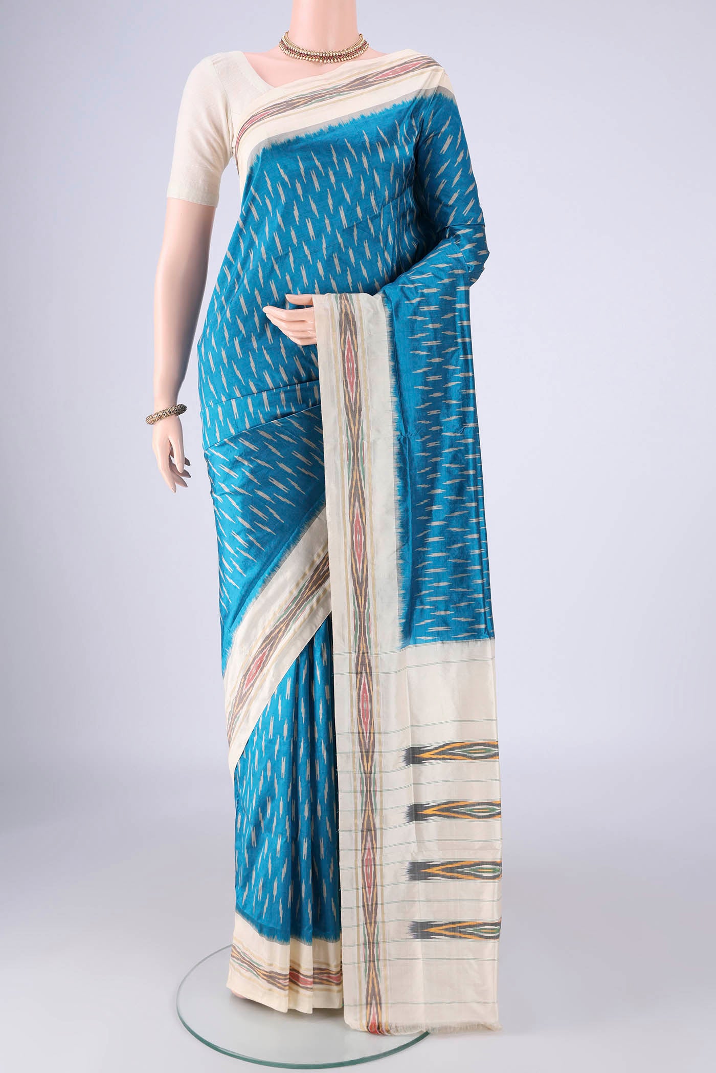 Blue Pochampally Silk Saree with Pure Ikat on the body and Ikat Border.  displayed on a mannequin
