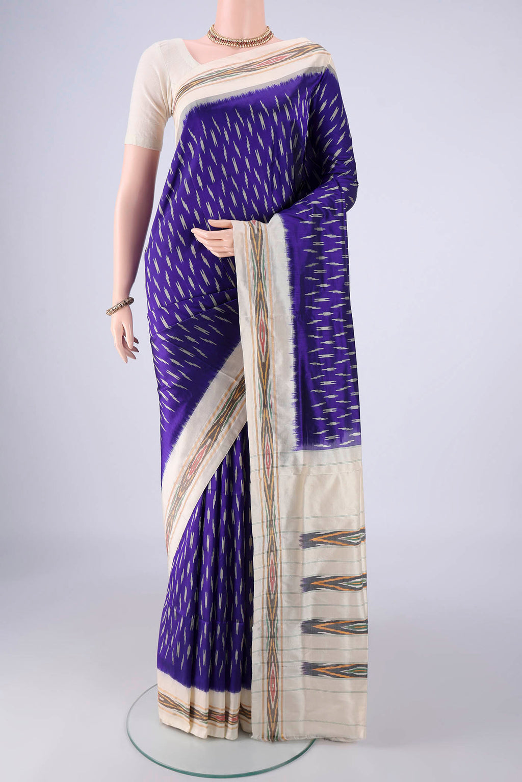 Dark Blue Pochampally Silk Saree with Pure Ikat on the body and Ikat Border.  displayed on a mannequin