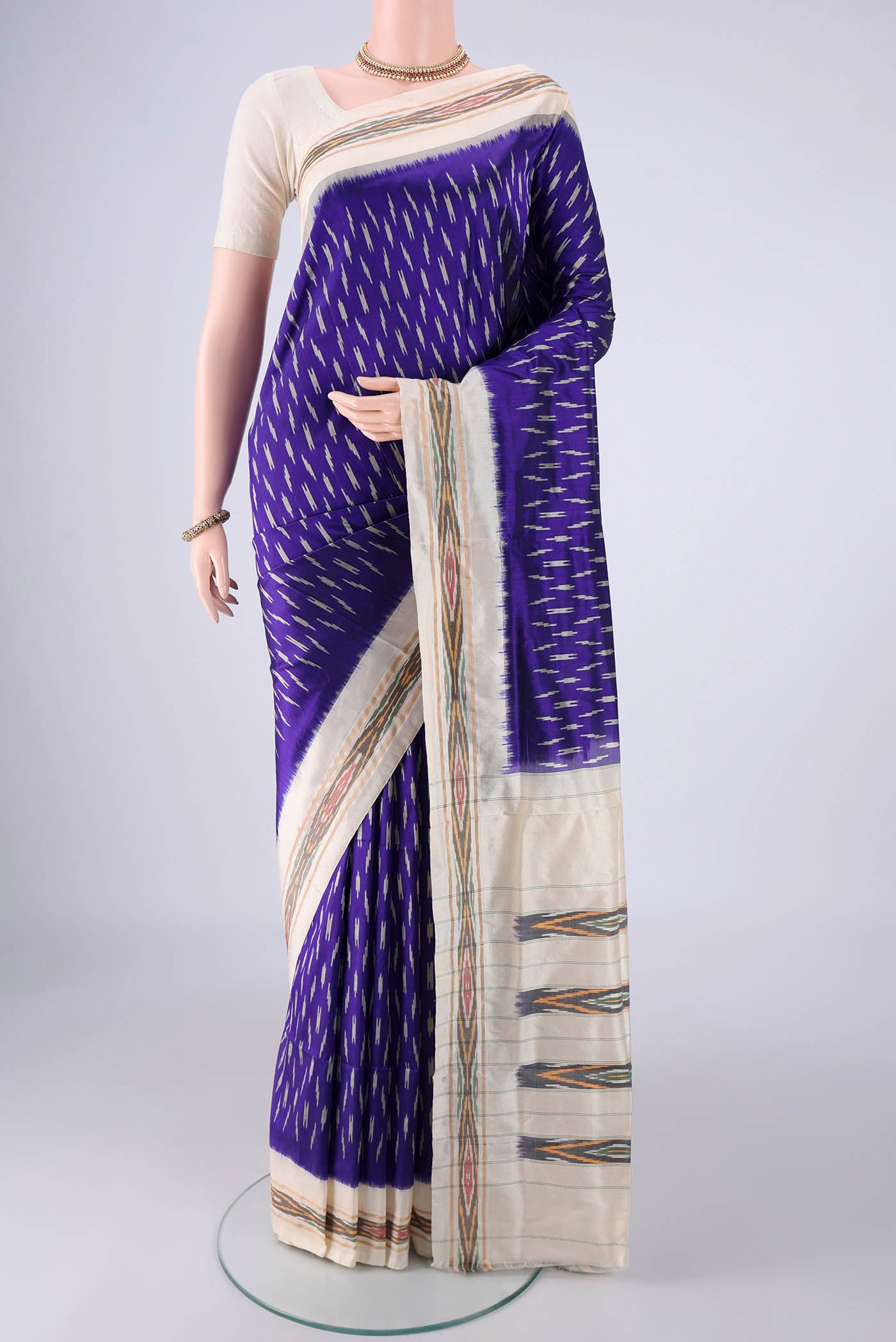 Dark Blue Pochampally Silk Saree with Pure Ikat on the body and Ikat Border.  displayed on a mannequin