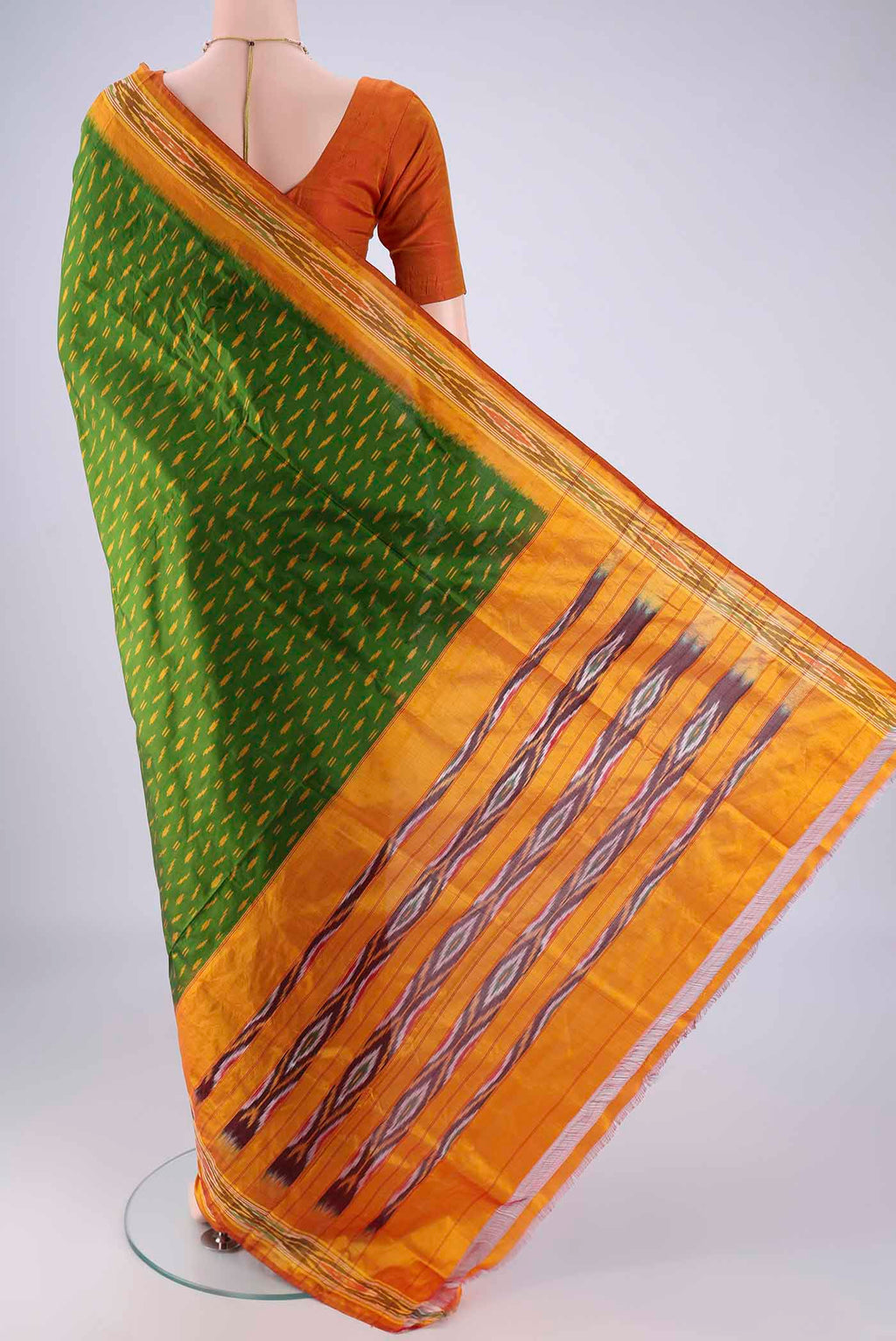 Flat view of Green Pochampally Silk Saree with Pure Ikat on the body and Ikat Border. 