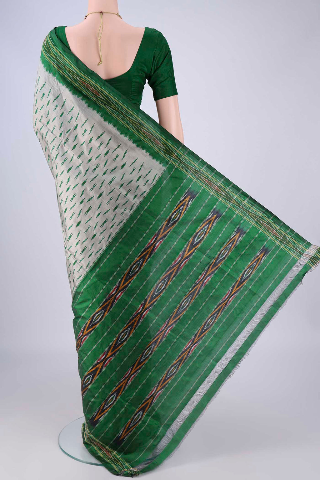 Flat view of Grey Pochampally Silk Saree with Pure Ikat on the body and Ikat Border. 