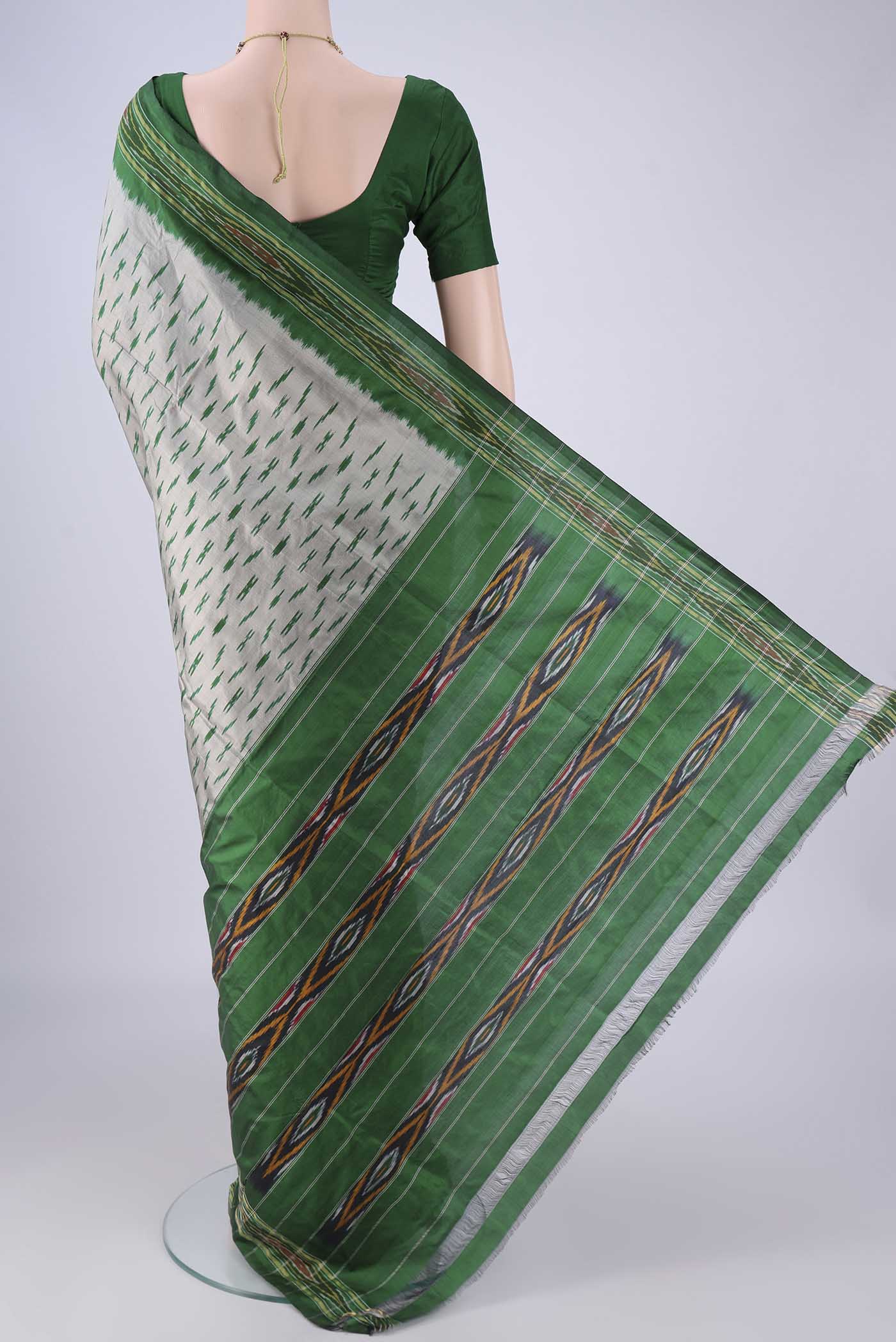 Flat view of Grey Pochampally Silk Saree with Pure Ikat on the body and Ikat Border. 