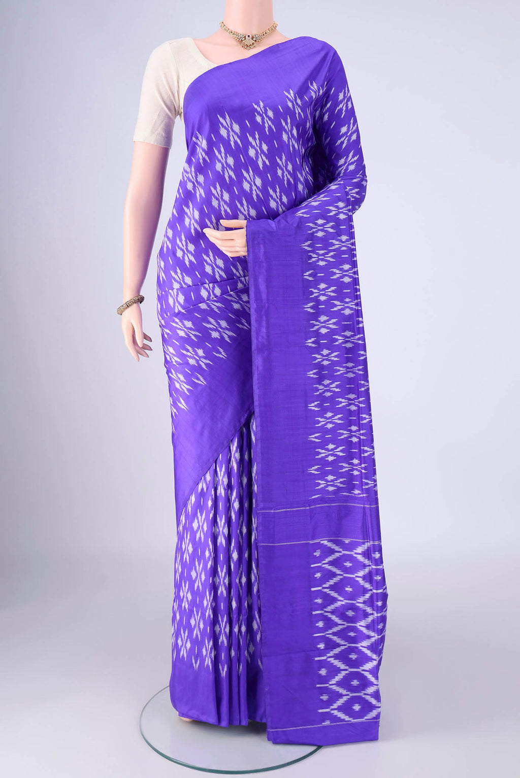 Violet Pochampally Silk Saree with Pure Ikat on the body and Without Border.  displayed on a mannequin