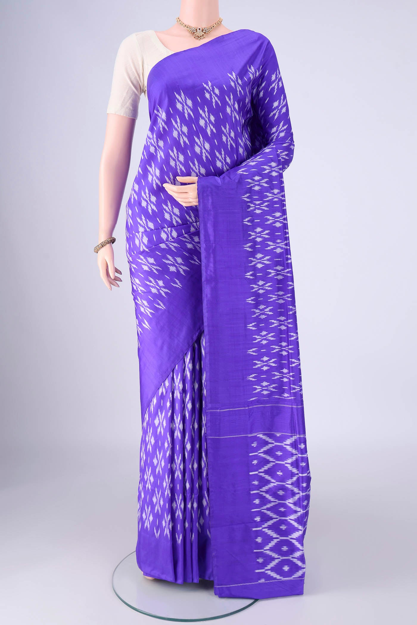Violet Pochampally Silk Saree with Pure Ikat on the body and Without Border.  displayed on a mannequin