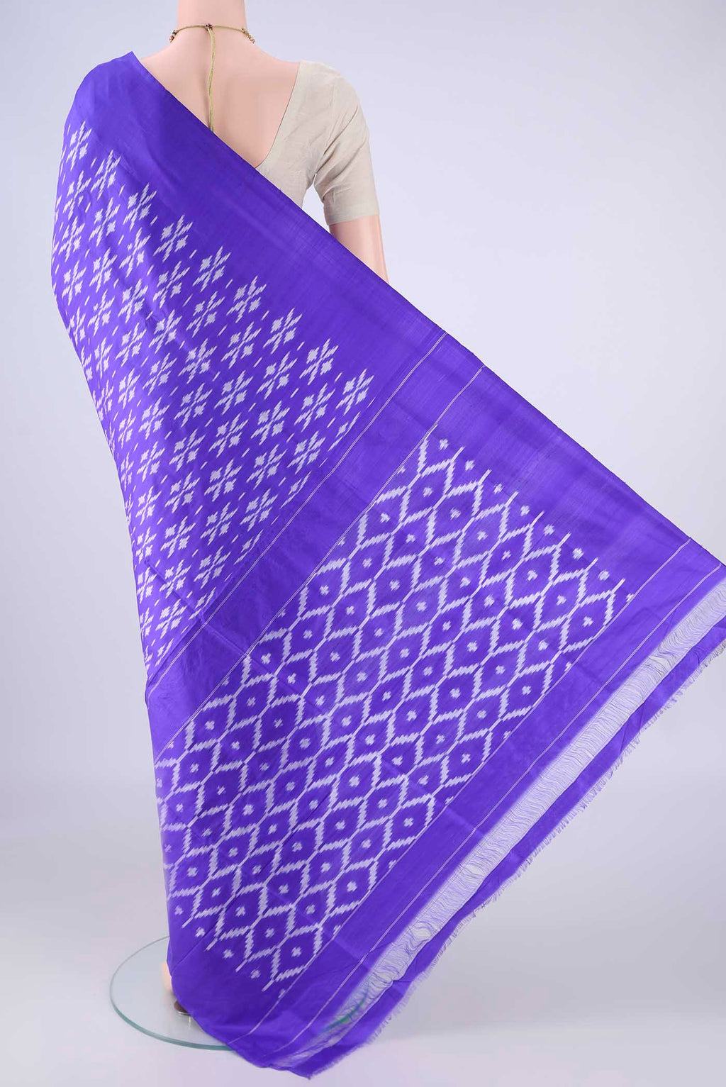 Flat view of Violet Pochampally Silk Saree with Pure Ikat on the body and Without Border. 