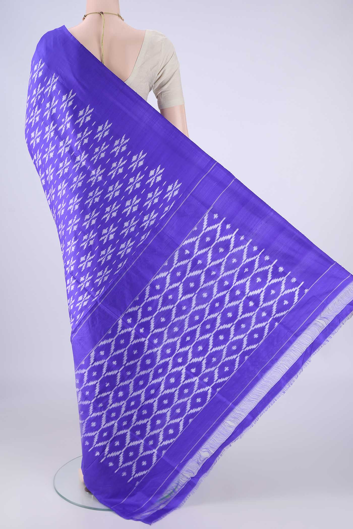 Flat view of Violet Pochampally Silk Saree with Pure Ikat on the body and Without Border. 