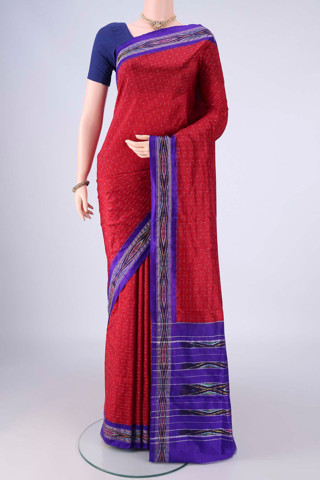 Maroon Pochampally Silk Saree with Pure Ikat on the body and Ikat Border.  displayed on a mannequin