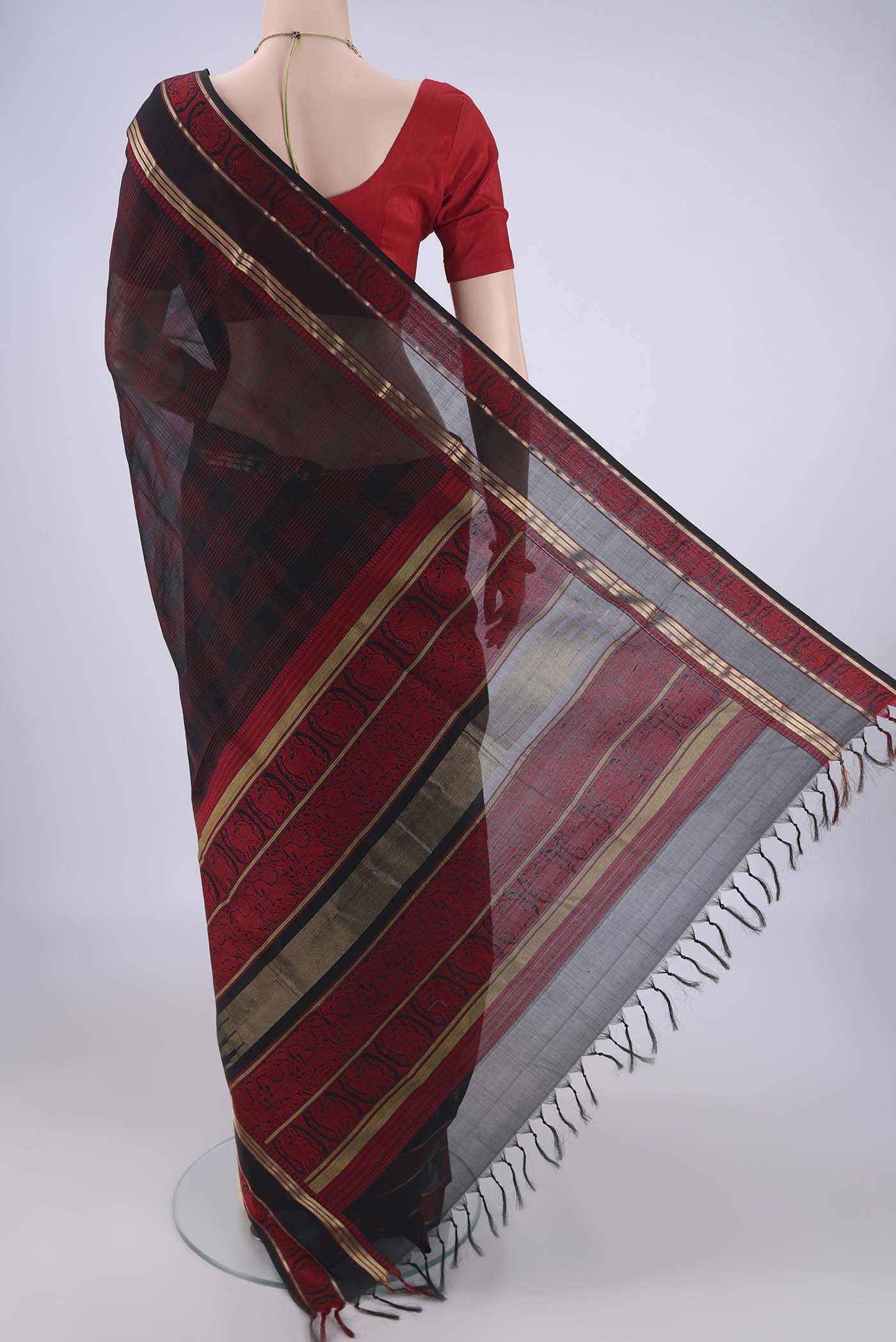 Flat view of Black Blended Kanchi Cotton Saree with Checked design on the body and Zari Border. 