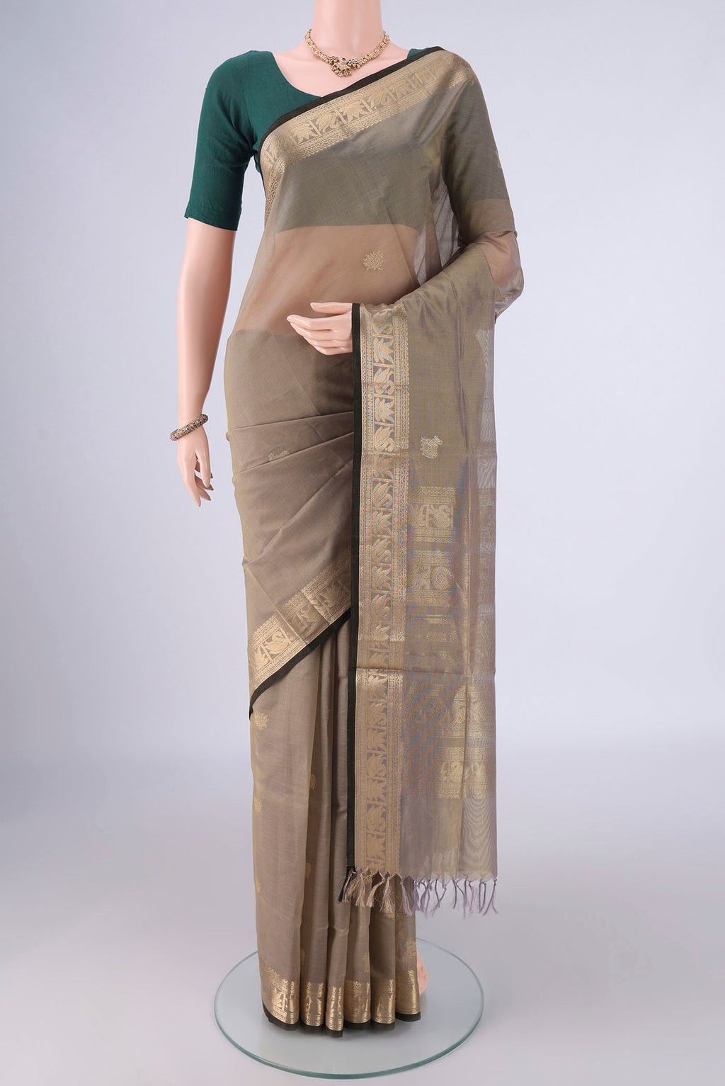Davys Grey Kanchi Cotton Saree with Zari Butta on the body and Zari Border.  displayed on a mannequin