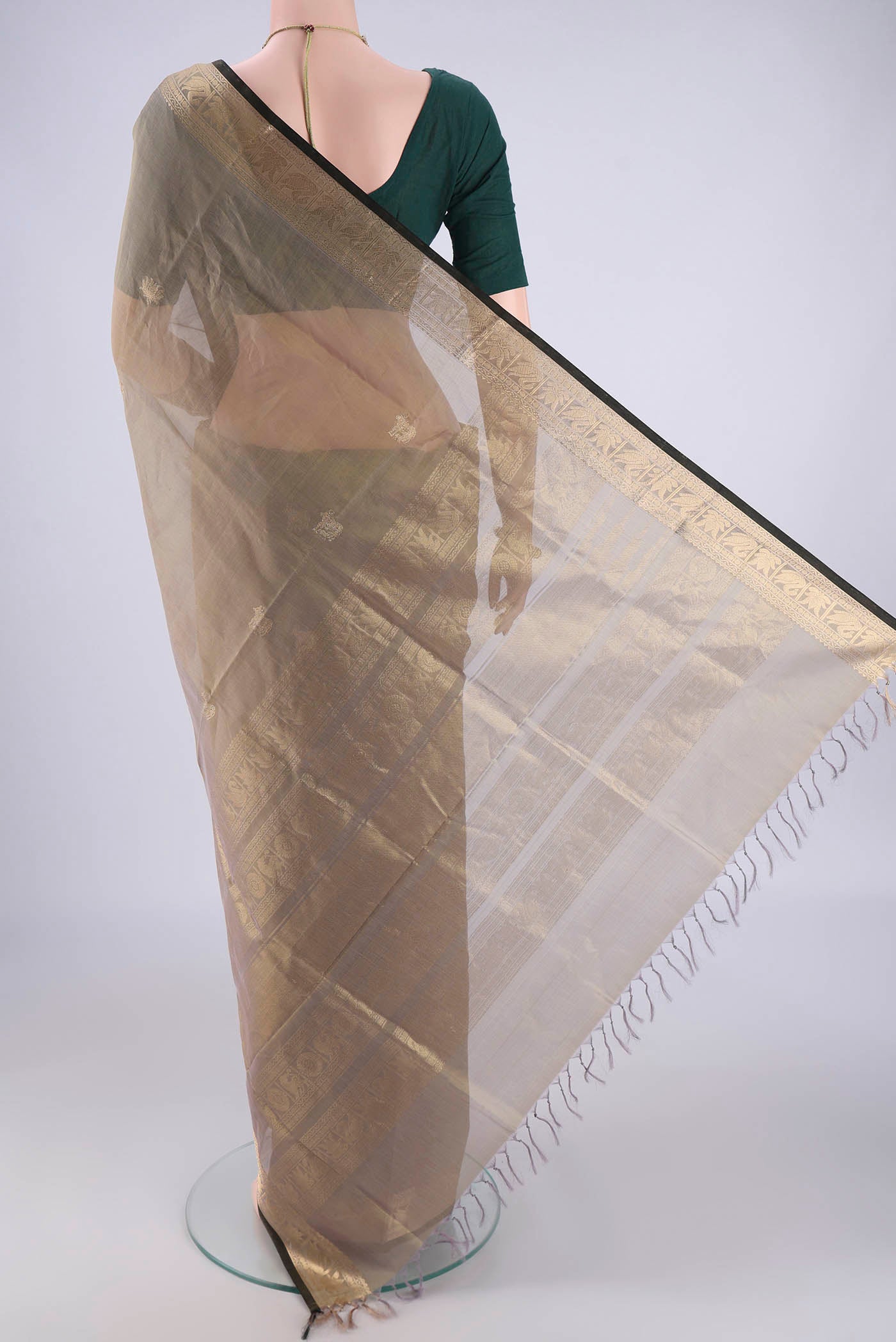 Flat view of Davys Grey Kanchi Cotton Saree with Zari Butta on the body and Zari Border. 