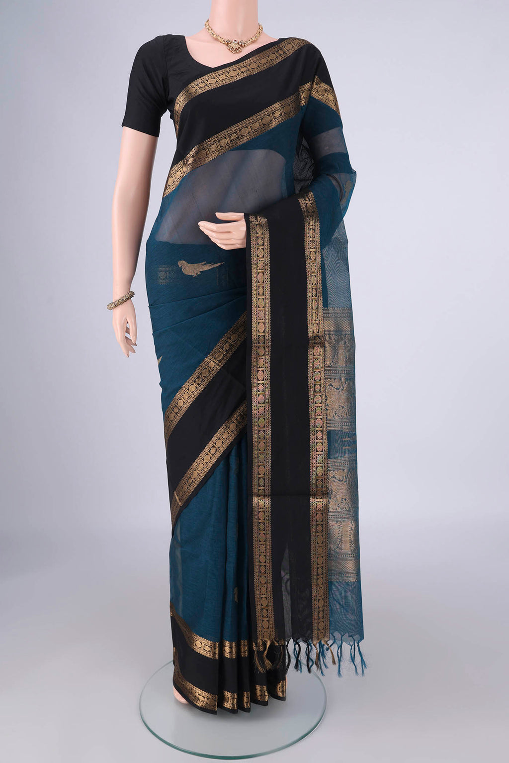 Blue Kanchi Cotton Saree with Zari Butta on the body and Zari Border.  displayed on a mannequin