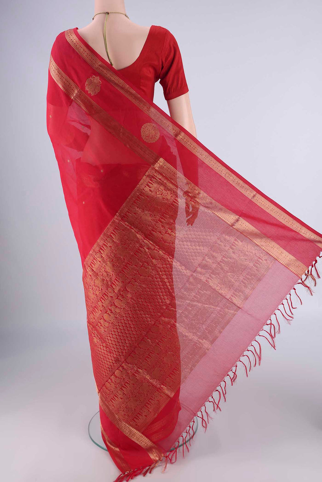 Flat view of Red Kanchi Cotton Saree with Zari Butta on the body and Zari Border. 
