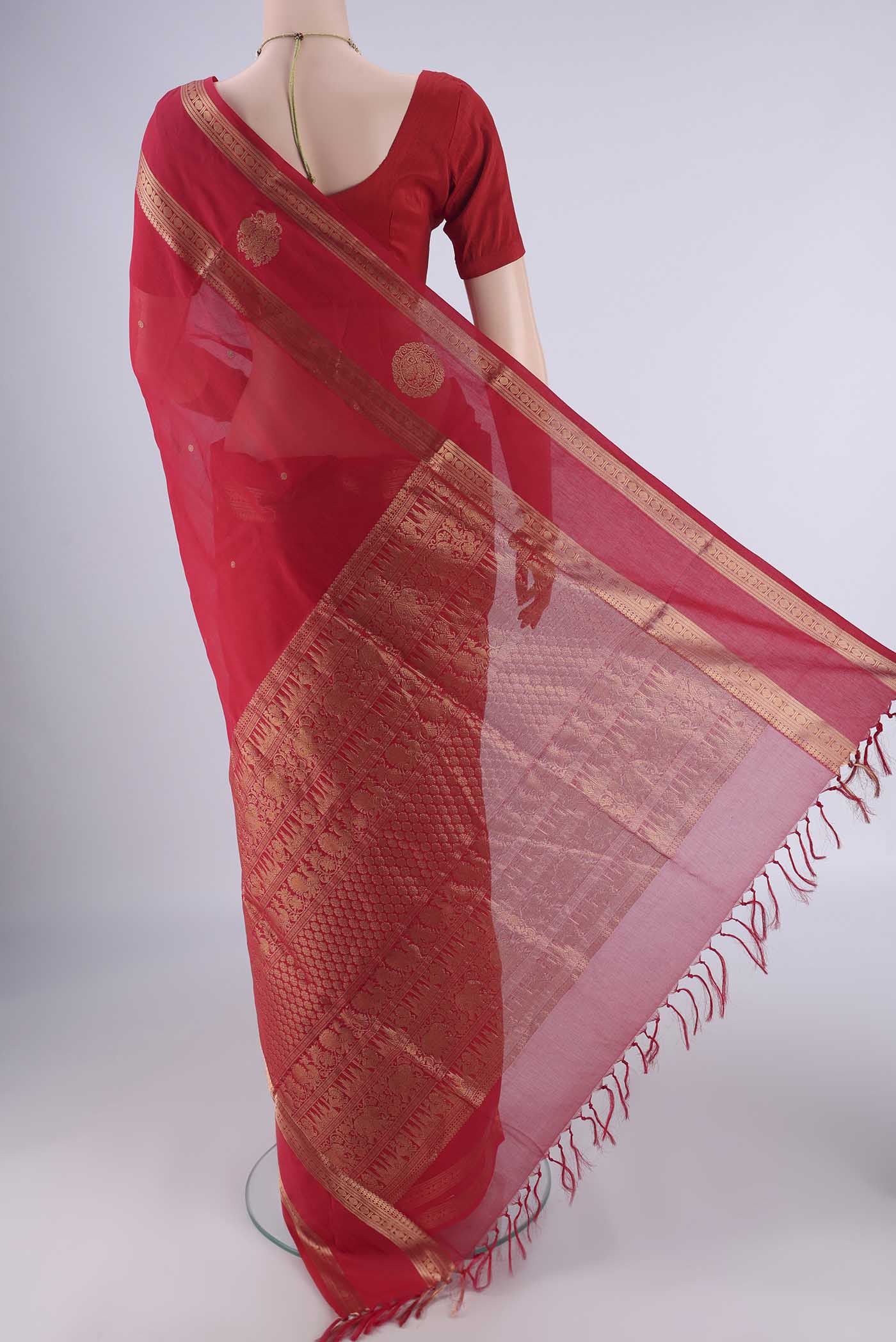 Flat view of Red Kanchi Cotton Saree with Zari Butta on the body and Zari Border. 
