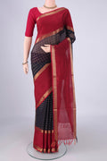 Navy Blue Coimbatore Silk Cotton Saree with Checked design on the body and Zari Border.  displayed on a mannequin