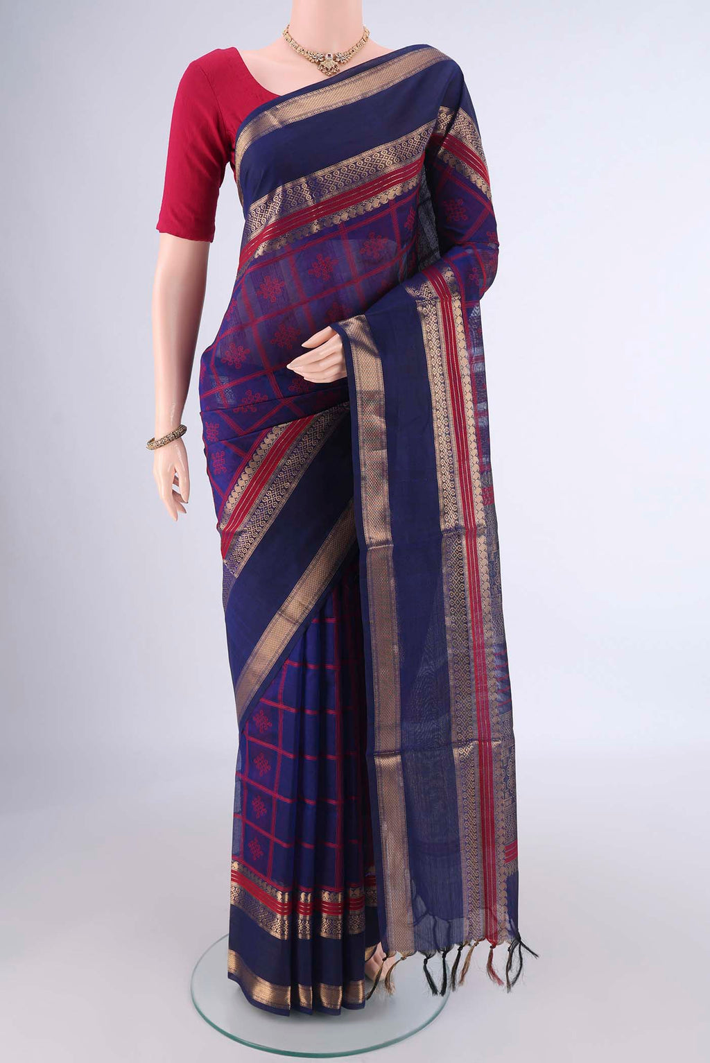 Navy Blue Coimbatore Silk Cotton Saree with Checked design on the body and Zari Border.  displayed on a mannequin