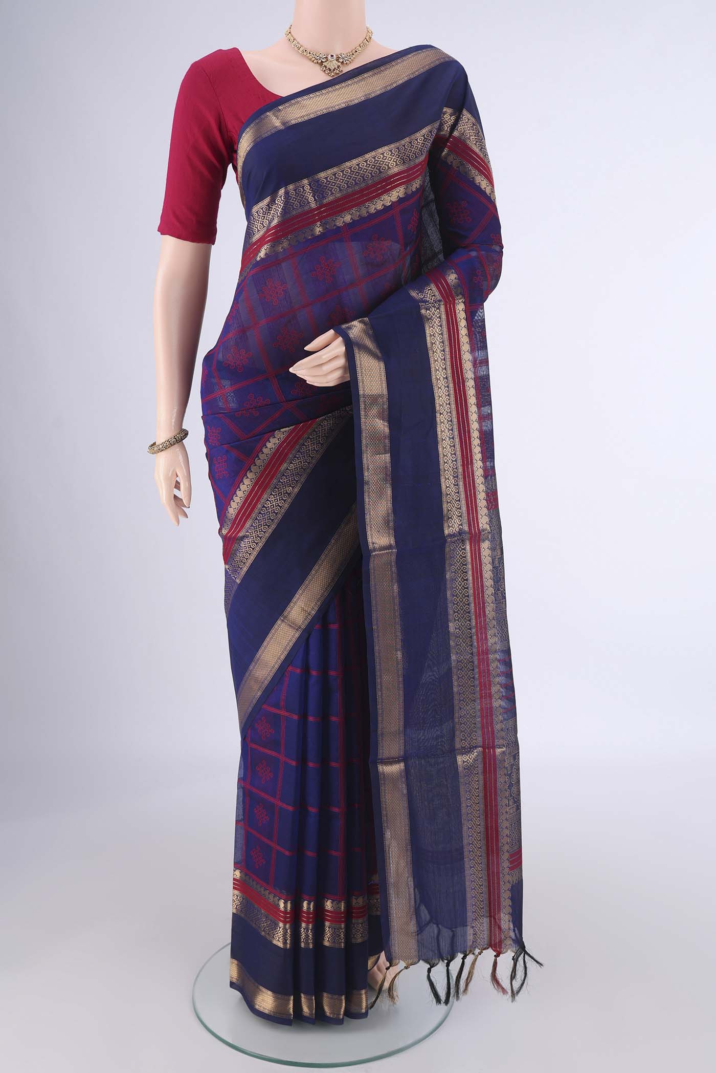 Navy Blue Coimbatore Silk Cotton Saree with Checked design on the body and Zari Border.  displayed on a mannequin