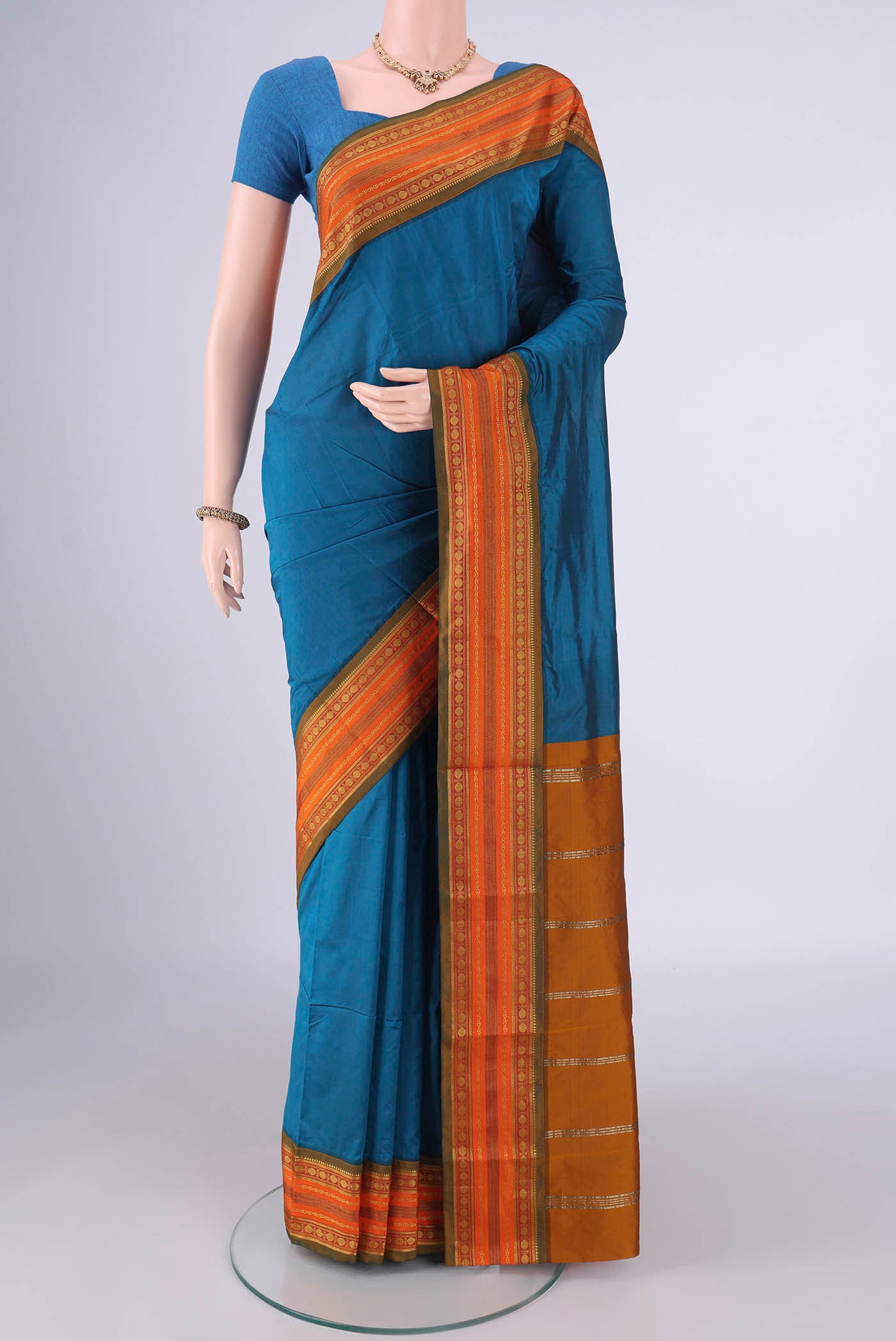 Blue Blended Bangalore Silk Saree with Plain Body and Zari Border.  displayed on a mannequin
